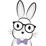 A headshot of a rabbit wearing glasses and a purple bowtie.
